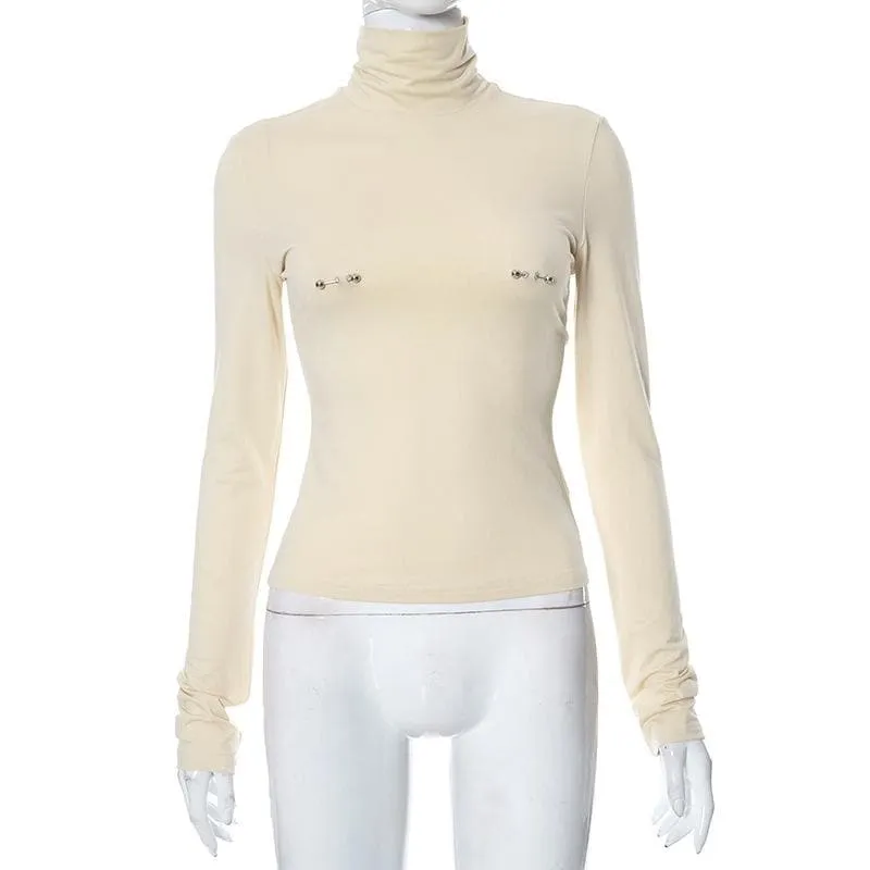 Metal applique turtle neck long sleeve solid top