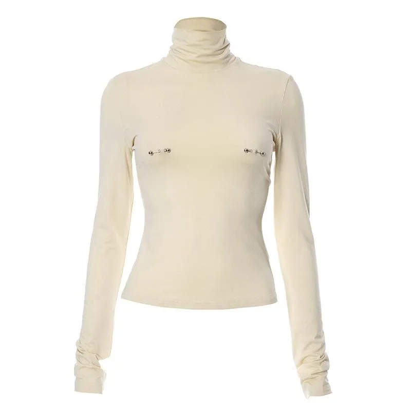 Metal applique turtle neck long sleeve solid top