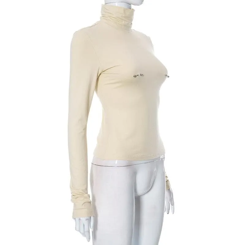 Metal applique turtle neck long sleeve solid top